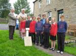  Past Pres Chris Wheatley presenting a cheque and stone plaque